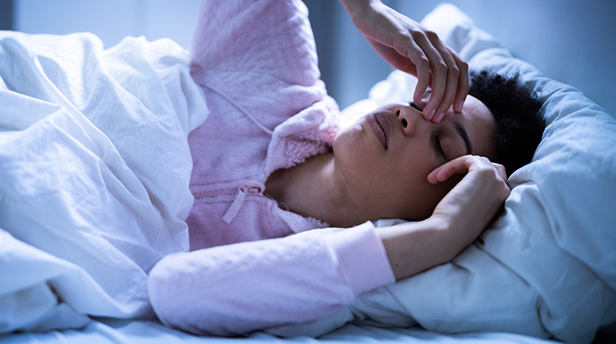 A patient learning about sleep and muscle recovery in Courtice at Active Recovery Clinic.