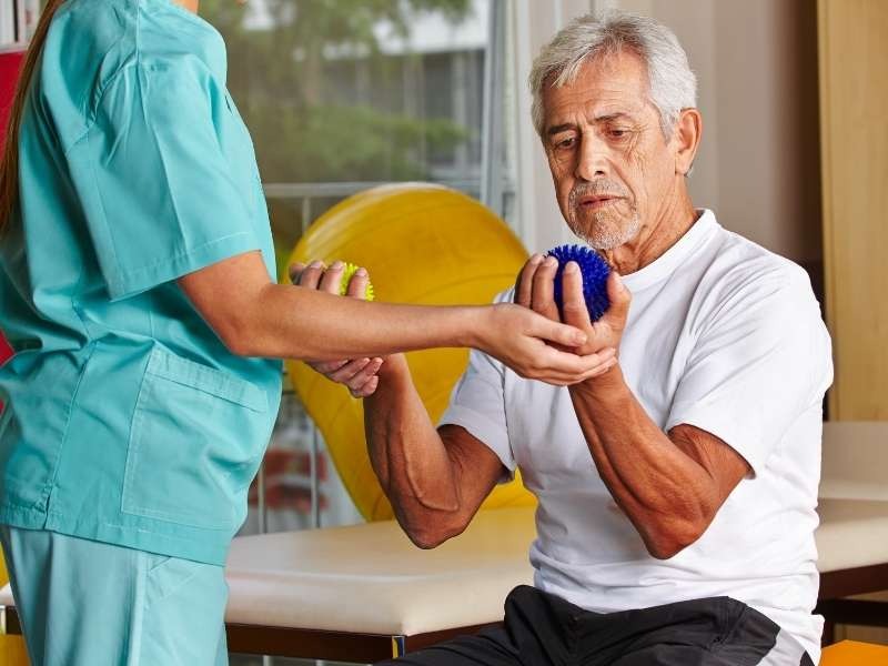 Parkinson's fall prevention physiotherapy Durham Region — balance exercise Courtice Pickering Parkinson's Disease physiotherapy management Courtice session at Active Recovery Clinic